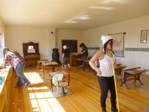 Students admired the one room log school house
